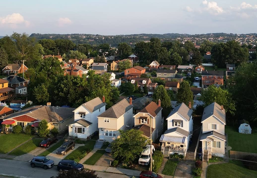 An aerial view of a row of multi-story townhouses in Pittsburgh, Pennsylvania.